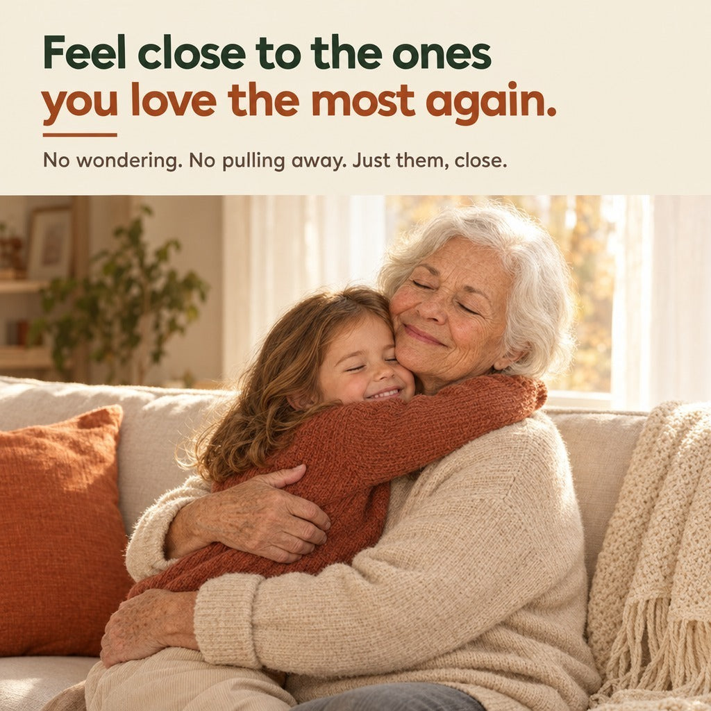 A grandmother hugging her grandchild on a sofa.